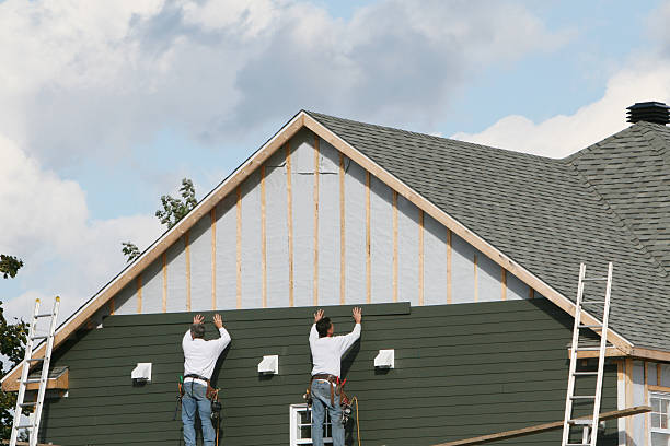 Professional Storm Damage Siding Repair technician working in Waltham, MA